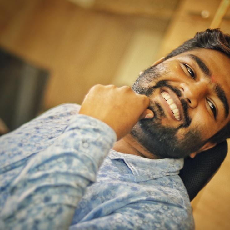 Kaveri Mehta, Lead Design Curator at Tiny River Gate, reviewing corporate floral arrangements